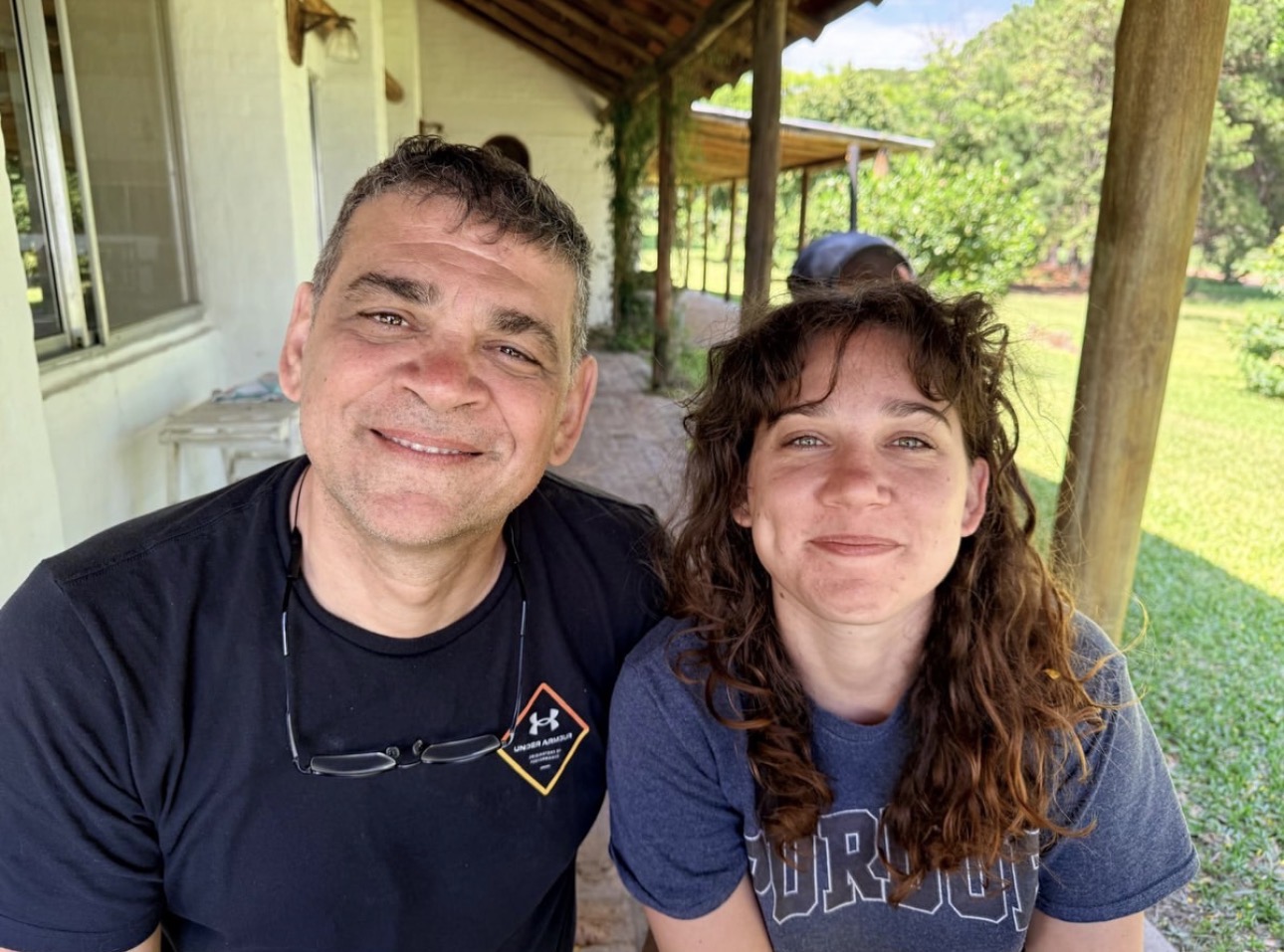 Mica with family on a sunny porch in Argentina