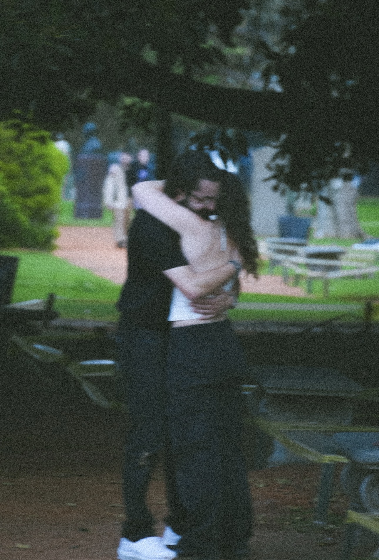 Mica and Alex embracing after their engagement