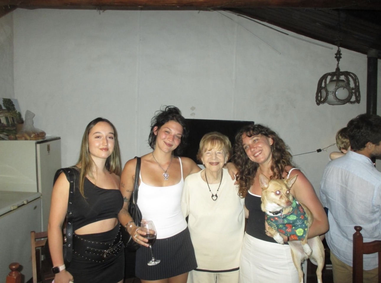 Family gathered indoors with a small dog